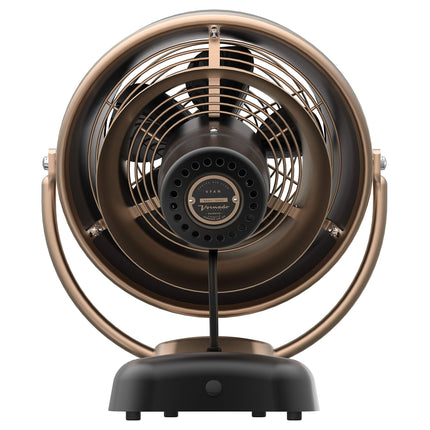 Vintage-style desk fan with bronze and black design on a white background