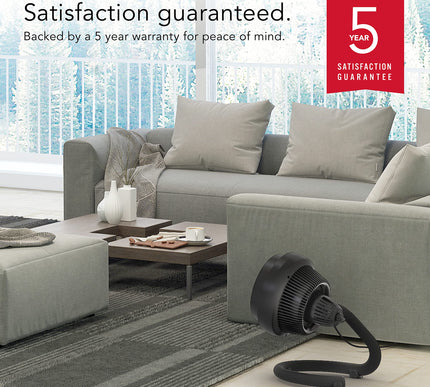 Gray sectional sofa in a living room with a 5-year satisfaction guarantee badge.