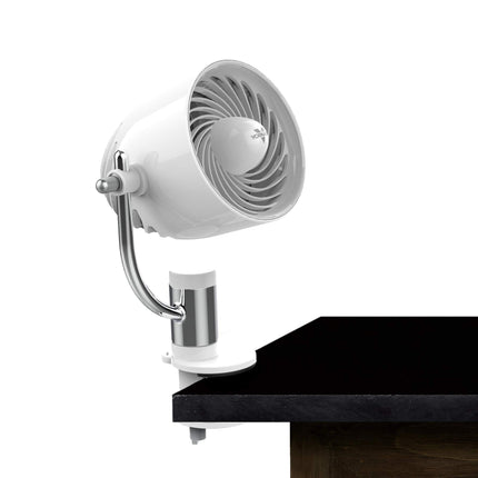 White clip fan on a table