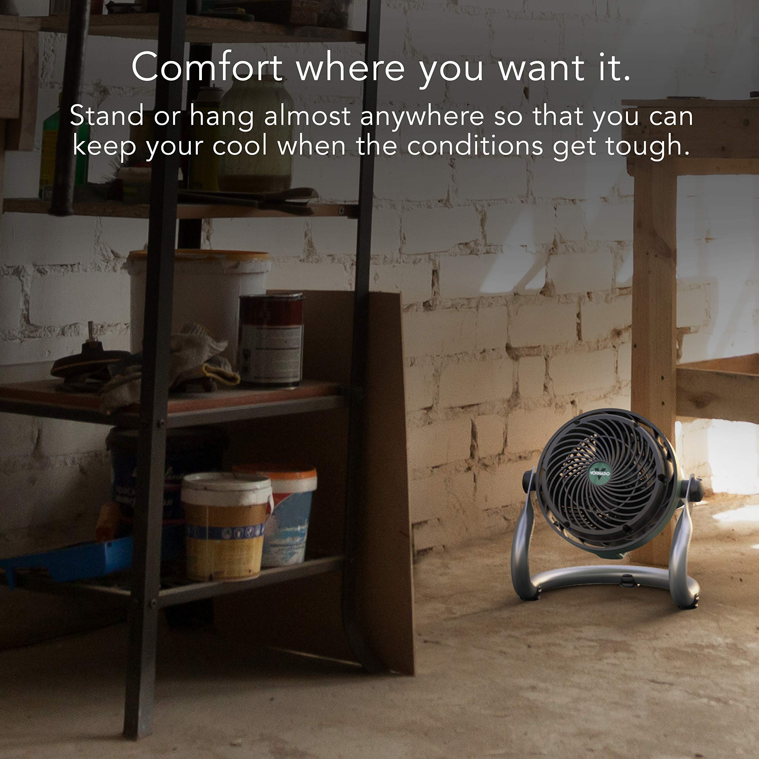 Portable fan in a workshop with text about comfort and flexibility.