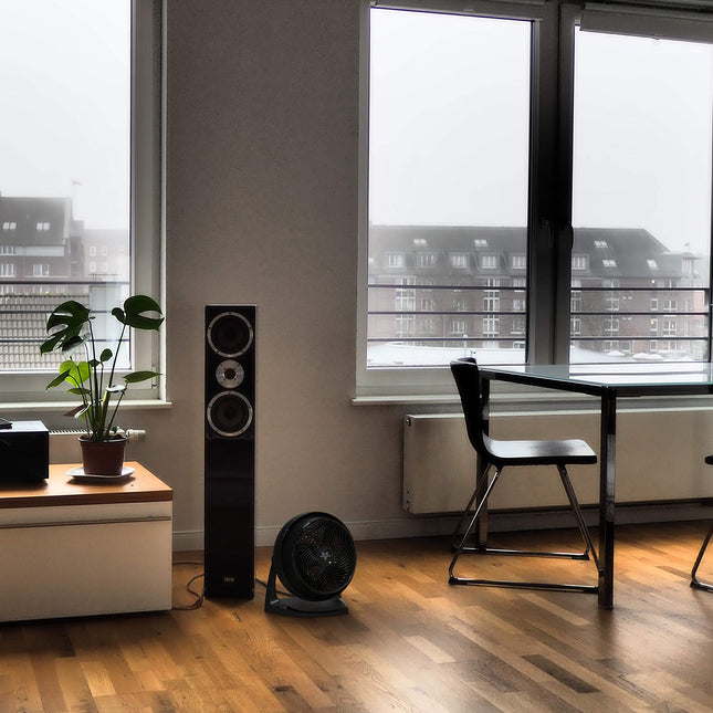 Modern room with a desk, chair, and large window