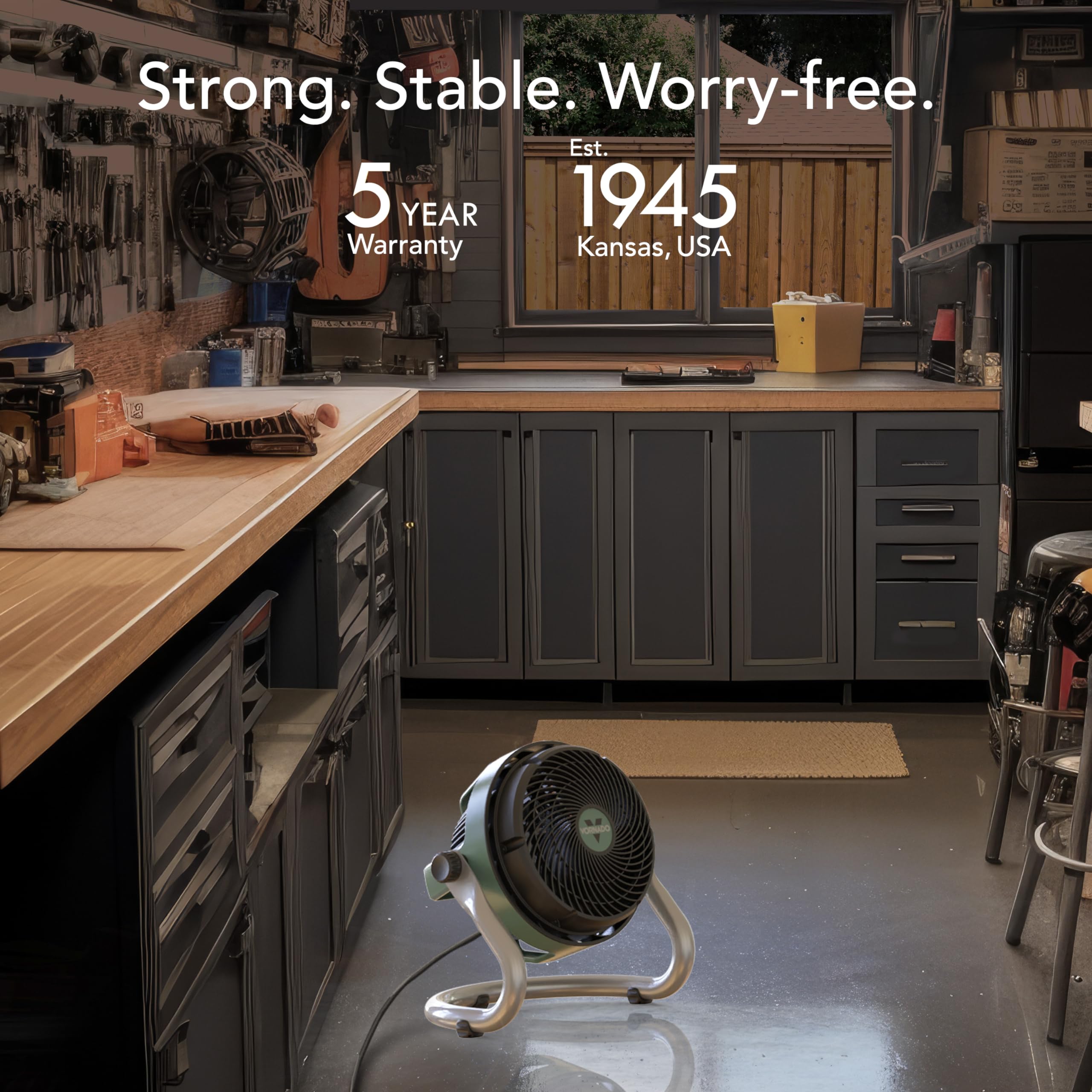 Workshop with cabinets and a fan, featuring text about a 5-year warranty and establishment year.