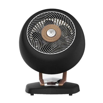 Black circular heater with gold center on a white background