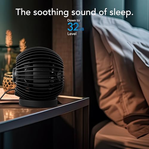 Black noise machine on a bedside table with text indicating sleep aid feature.