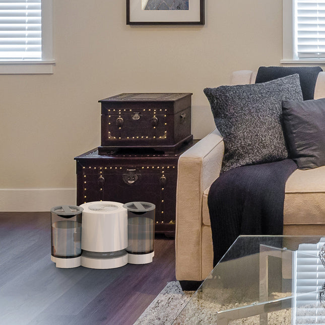 Humidifier in living room with tan couch and brown totes