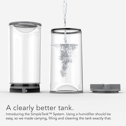 Humidifier tank with water being poured into it on a white background