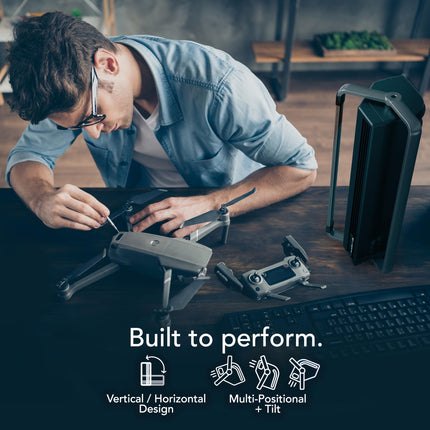 Person assembling a drone with text 'Built to perform' and icons below.