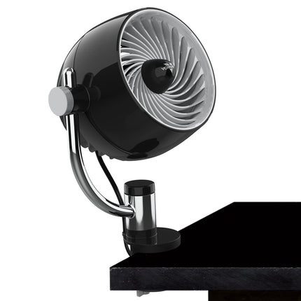 A vornado fan with a clip attached to a desk on a white background