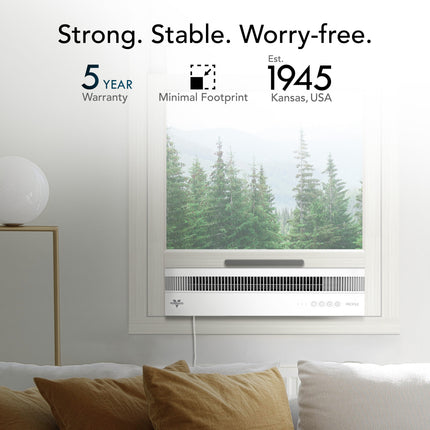 Window air conditioner with a view of trees, featuring a 5-year warranty and established in 1945 in Kansas, USA.