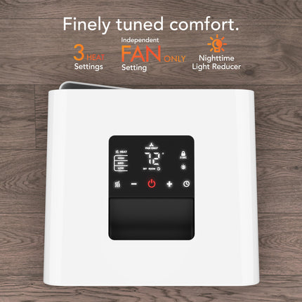 White heater with digital control panel on a wooden background
