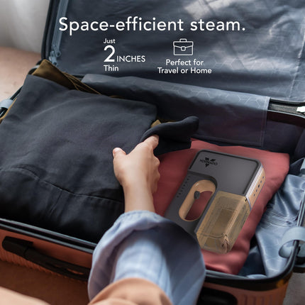 Person packing a suitcase with a space-efficient steam device, emphasizing its thinness and portability.