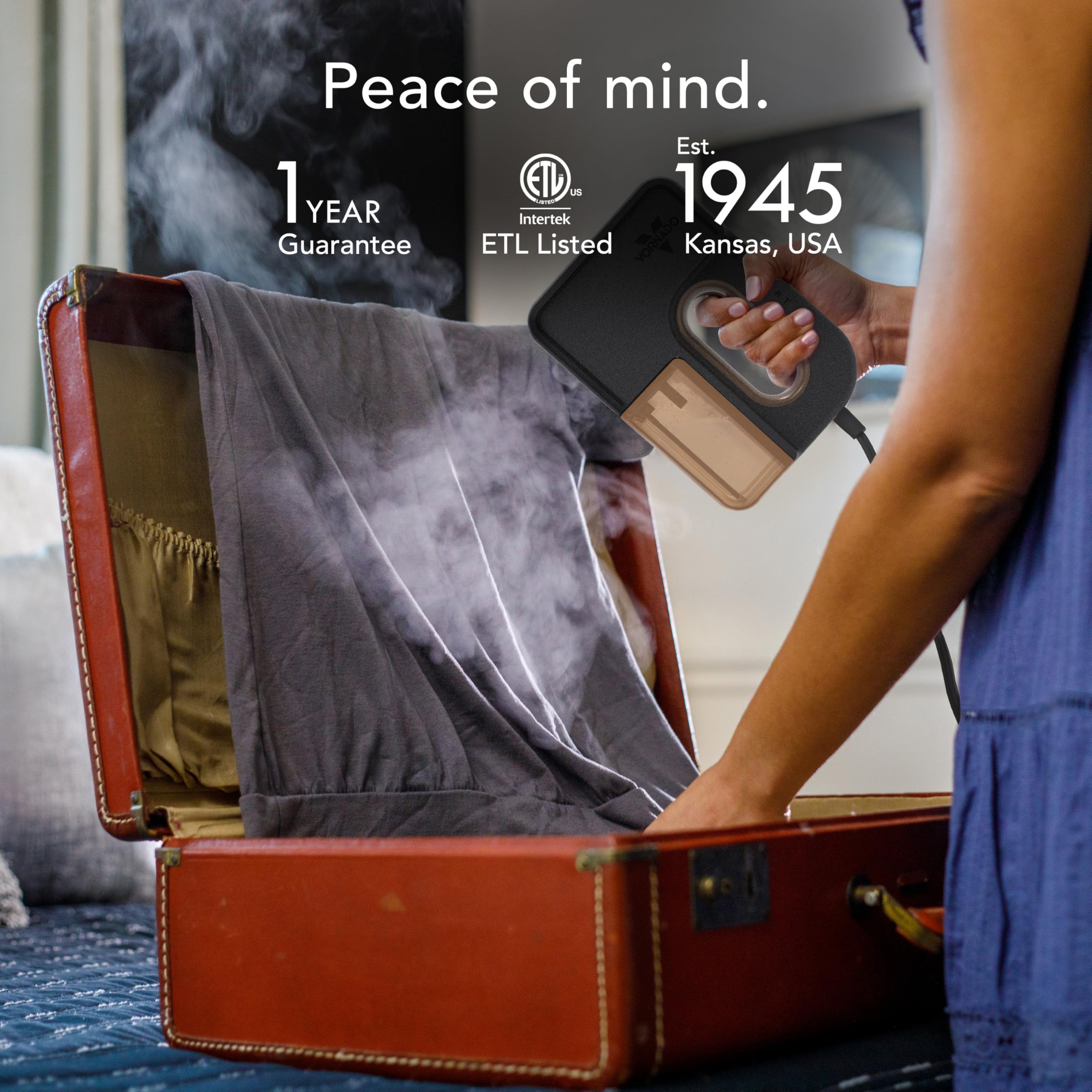 Person using a fabric steamer in an open suitcase with text about peace of mind, guarantee, and certification.