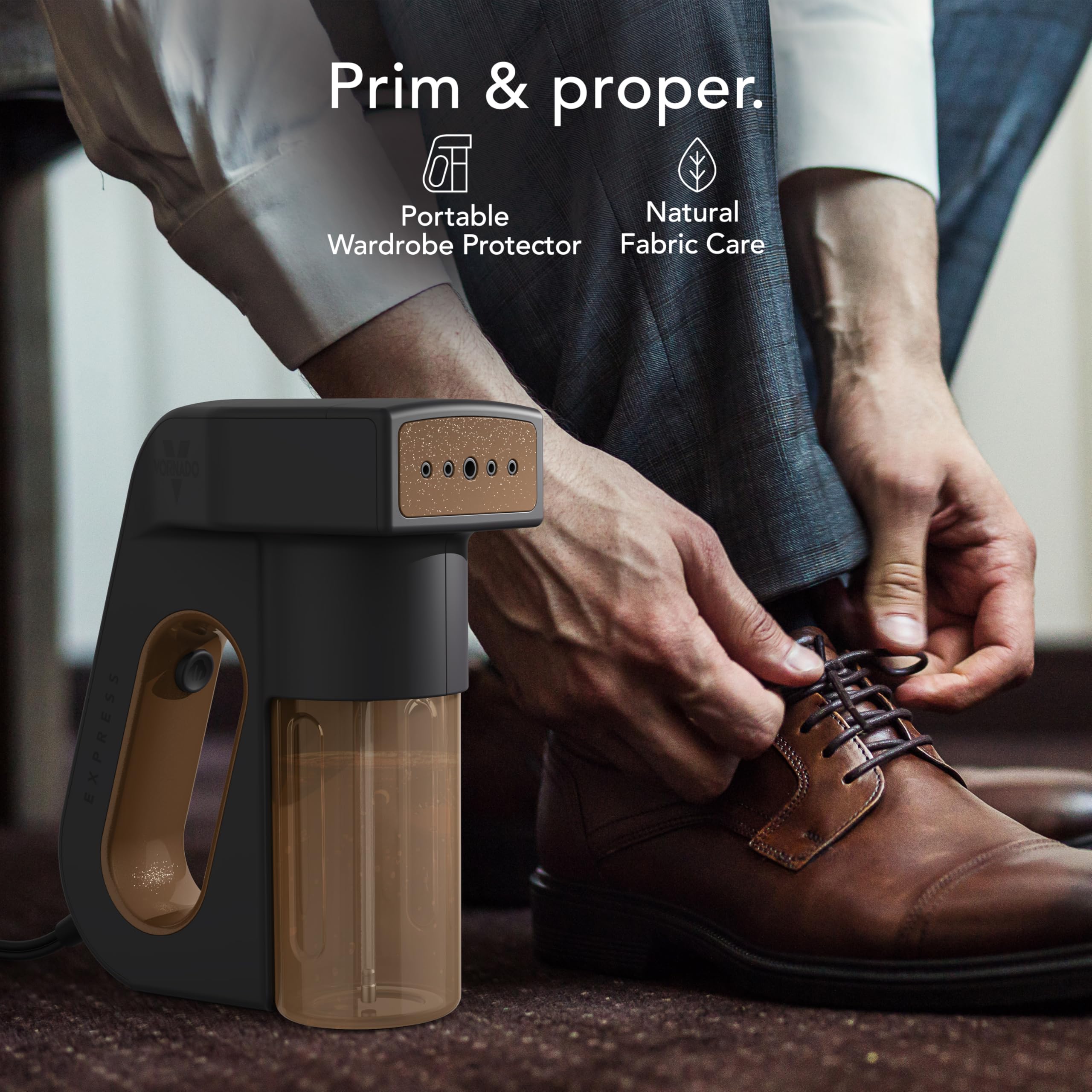 Person cleaning a brown shoe with a portable device, featuring 'Prim & Proper' branding.