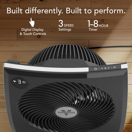 Black fan with digital display and touch controls on a wooden background