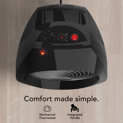 Black electric heater with control panel on a wooden background, featuring text 'Comfort made simple.'