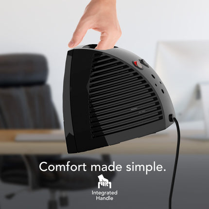 Black handheld heater with integrated handle held by a hand in an office setting, with text 'Comfort made simple.' and logo.
