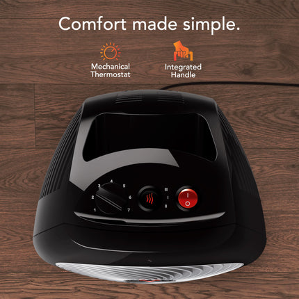 Black space heater on a wooden background with text 'Comfort made simple.'