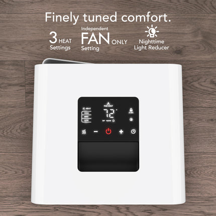White space heater with digital control panel on a wooden background