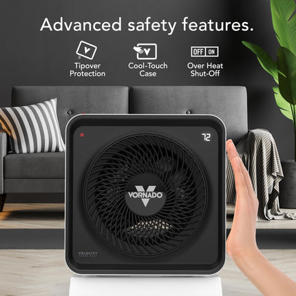 White Vornado heater with safety features text and icons in a living room setting