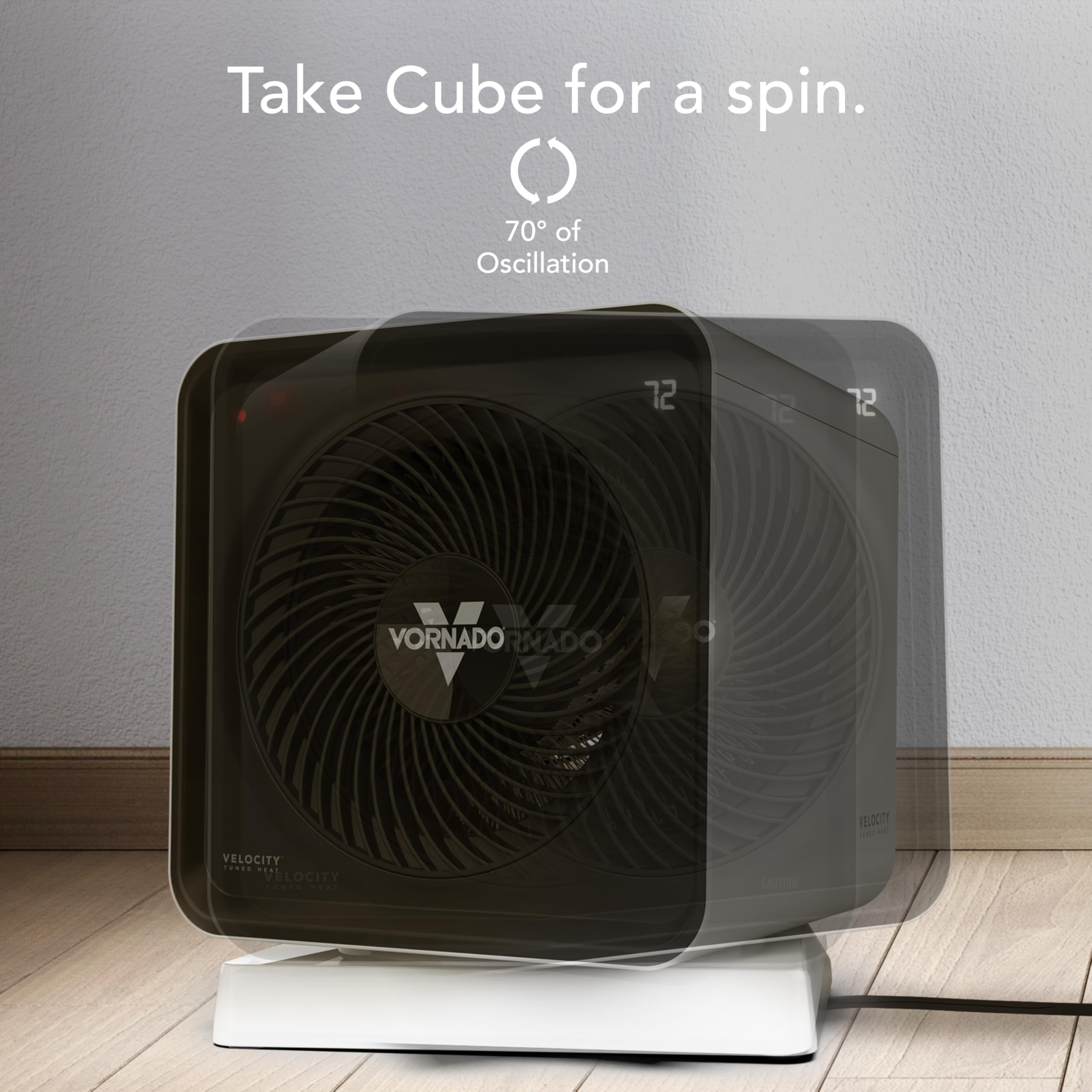 Black Vornado Cube heater on a wooden floor with a gray wall background