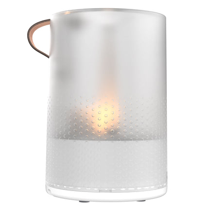 White humidifier with a light inside on a white background