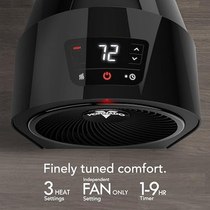 Black fan heater with digital display on a wooden surface, featuring the brand 'Vornado'.
