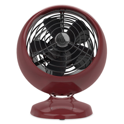 Red vintage-style fan on a white background