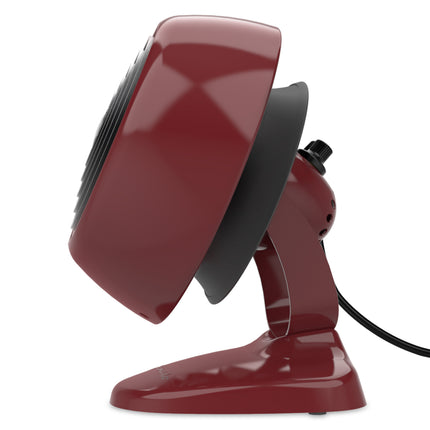 Red desk fan with a black handle on a white background