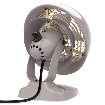 Vintage-style fan with a gray base and white top on a white background