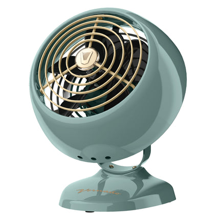 Vintage-style green fan with gold accents on a white background