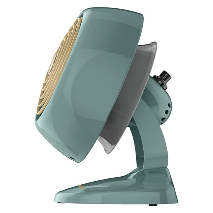 Teal desk fan with beige blades on a white background