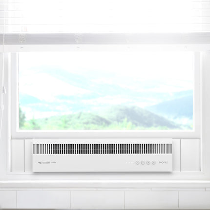 Modern kitchen hood with brand logo above a window with a view of mountains.