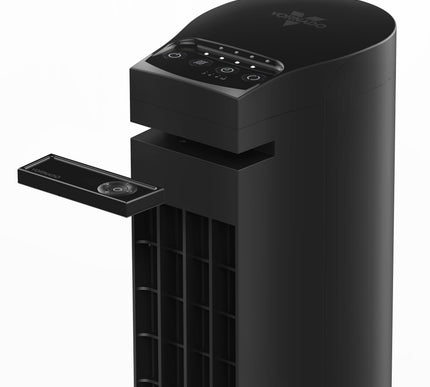 Black air purifier with control panel and remote on a white background