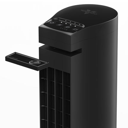 Black air purifier with control panel and remote on a white background