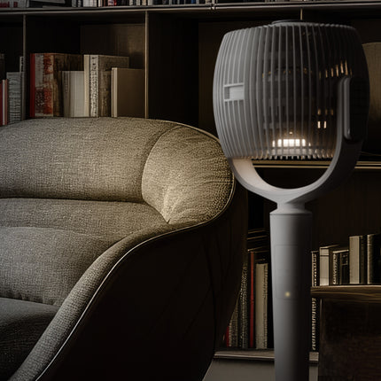 White oscillating pedestal fan in a reading room