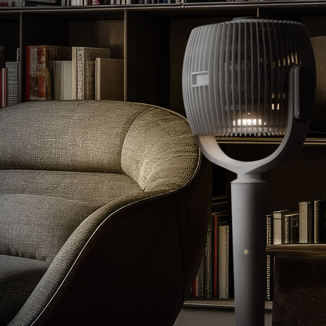 White oscillating pedestal fan in a reading room