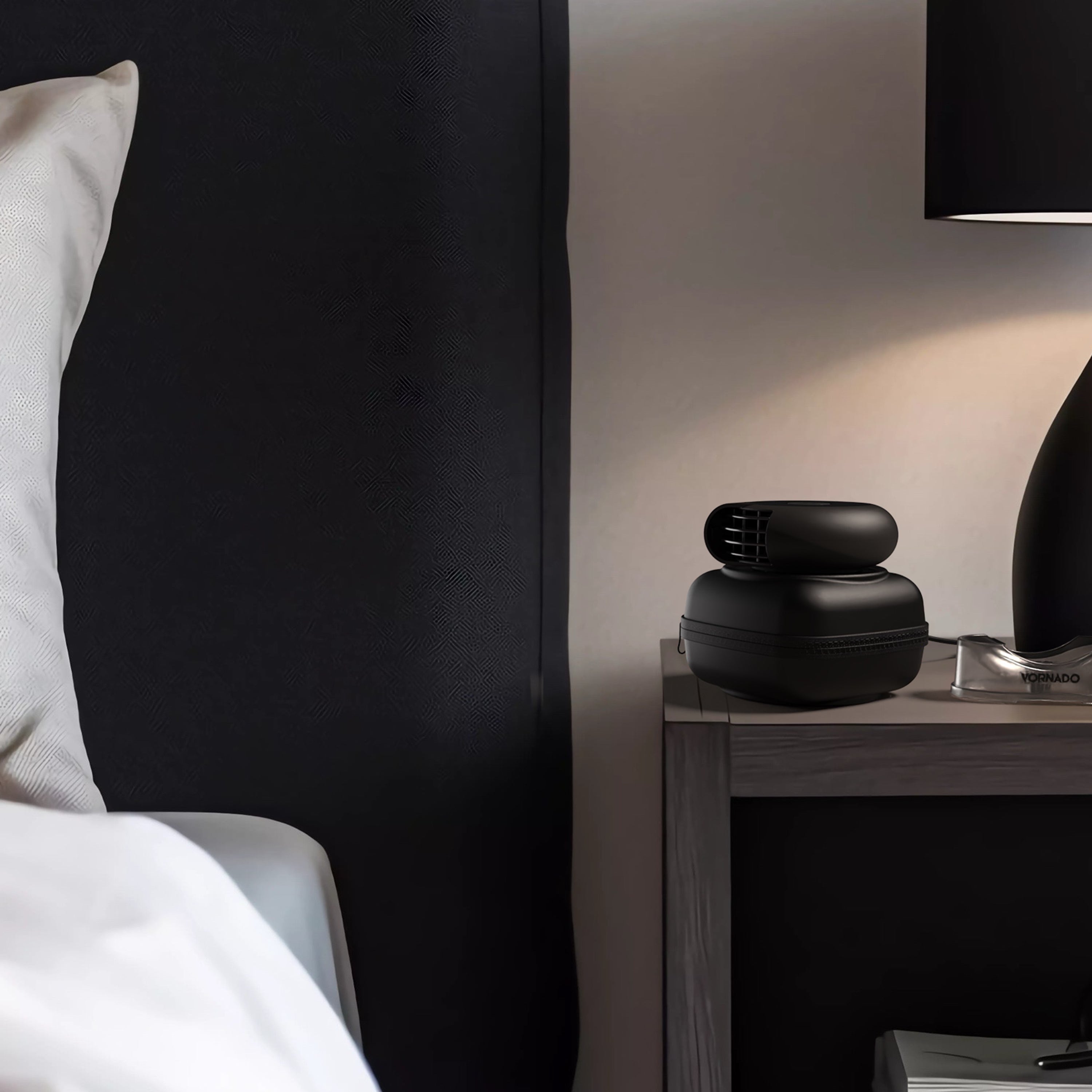 Portable pebl fan from Vornado featuring a power cord and black carry case