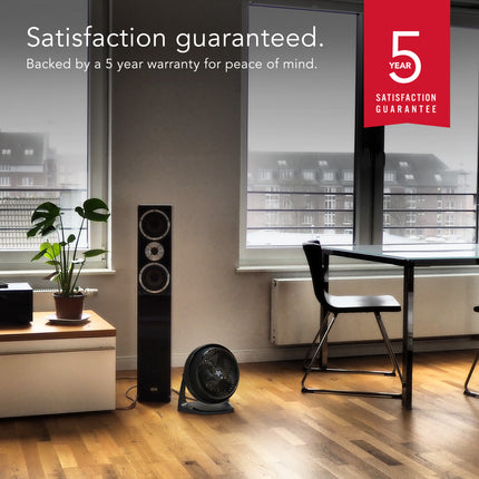 Room with furniture and a plant, featuring a 5-year satisfaction guarantee badge.