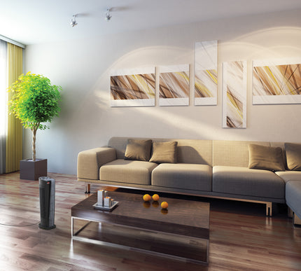 Modern living room with a beige sofa, wooden coffee table, and wall art.