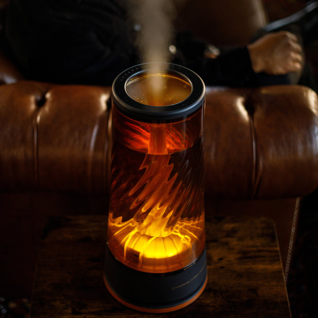 Decorative humidifier emitting steam on a brown leather couch