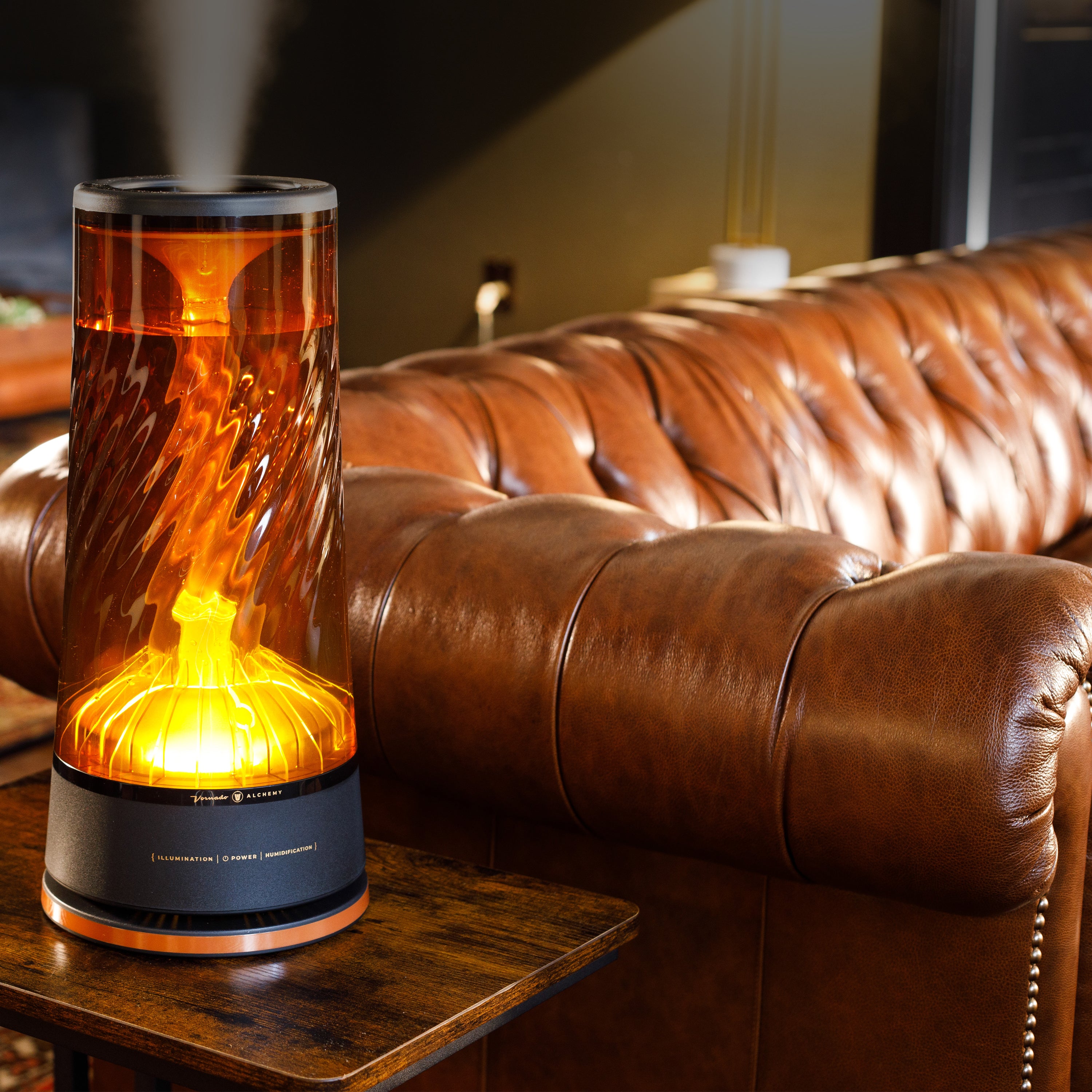 Decorative humidifier with flame-like design on a wooden table in front of a brown leather sofa.