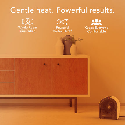 Wooden cabinet with a small fan on an orange background, featuring text about heating technology.