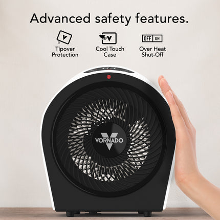 Vornado personal heater with safety features text and hand touching it on a light background