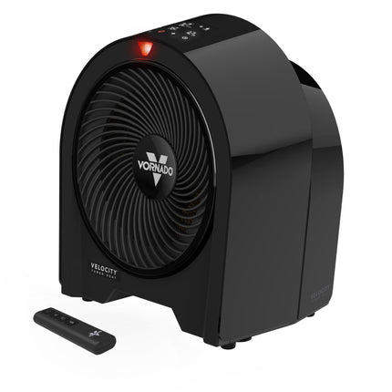 Black Vornado heater with remote control on a white background