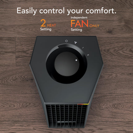 Black heater on a wooden floor with text about control settings.