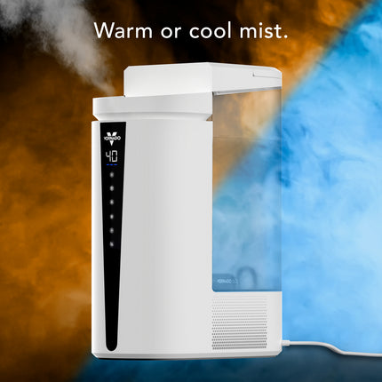 Humidifier with steam rising from it on a colorful background
