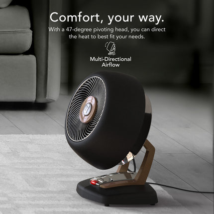 Black heater on a wooden floor with text about multi-directional airflow.