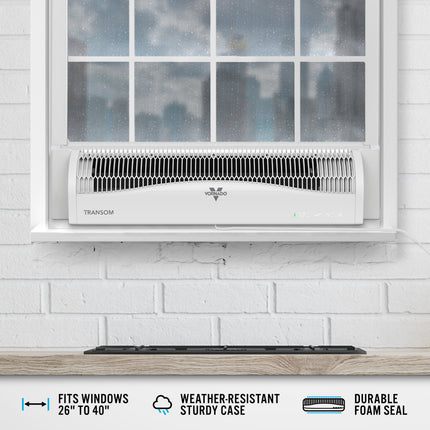 Window fan mounted in a white brick wall with a cloudy sky outside.