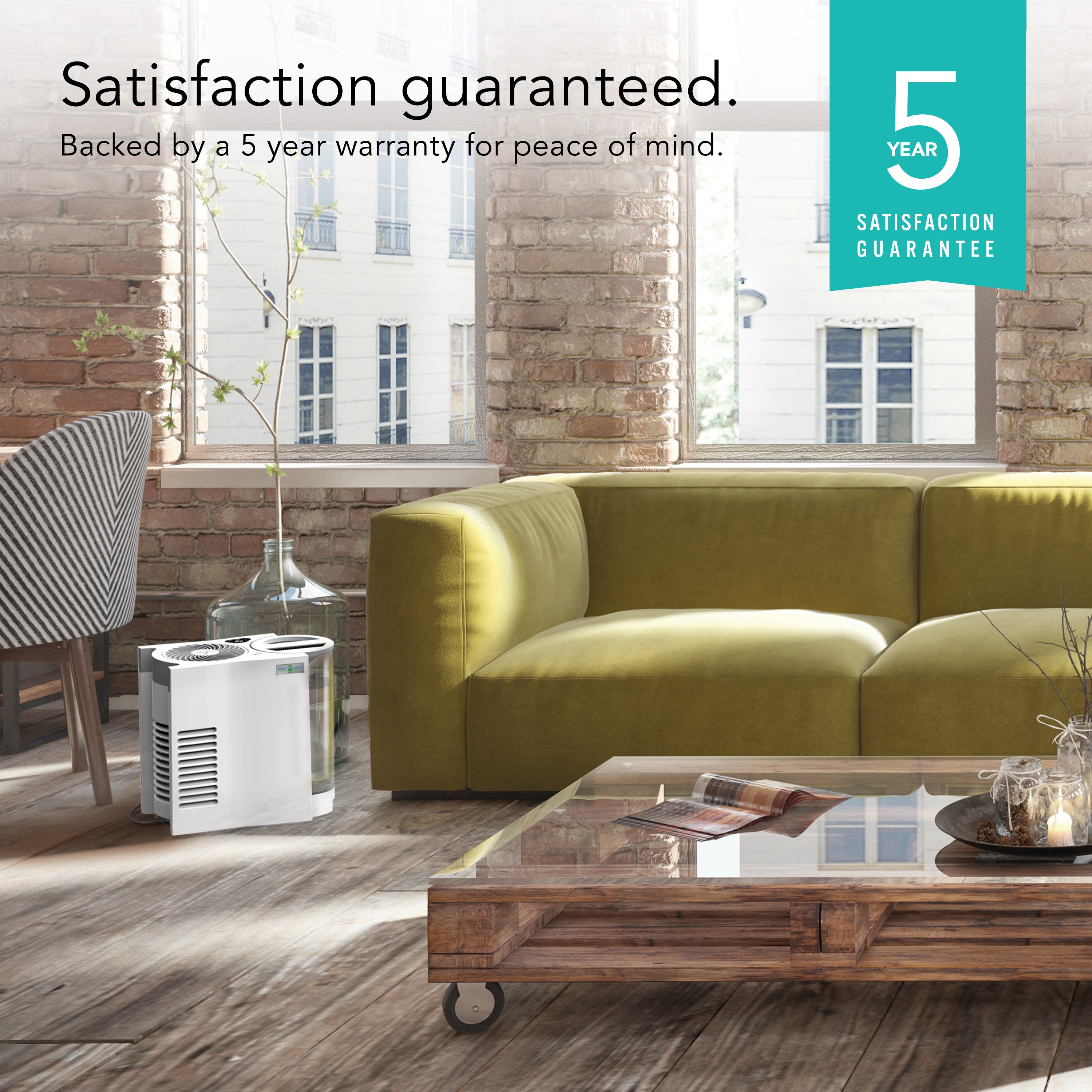 Living room with a green sofa, humidifier, and a 5-year satisfaction guarantee badge.