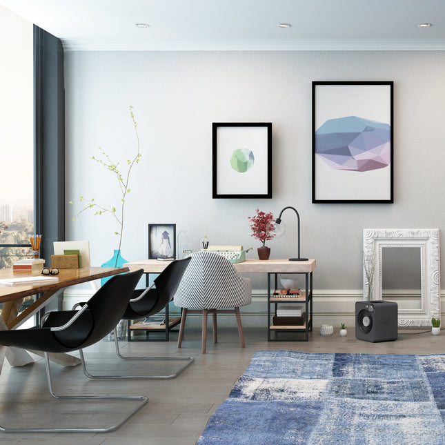 Modern office with a desk, chairs, and decorative elements.